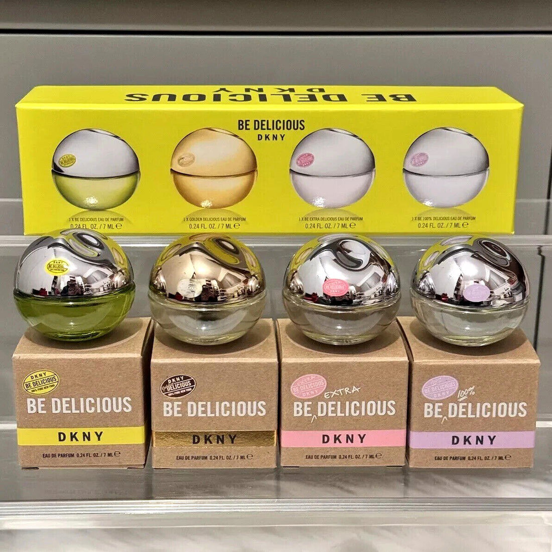 Donna Karan 4x7ml mini eau de parfum set for women including Be Delicious, Golden Delicious, Be Extra Delicious, and Be 100% Delicious, fresh and fruity feminine fragrances in compact bottles